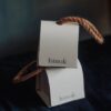 Eco-friendly flip-top paper box with natural rope handle for premium product packaging
