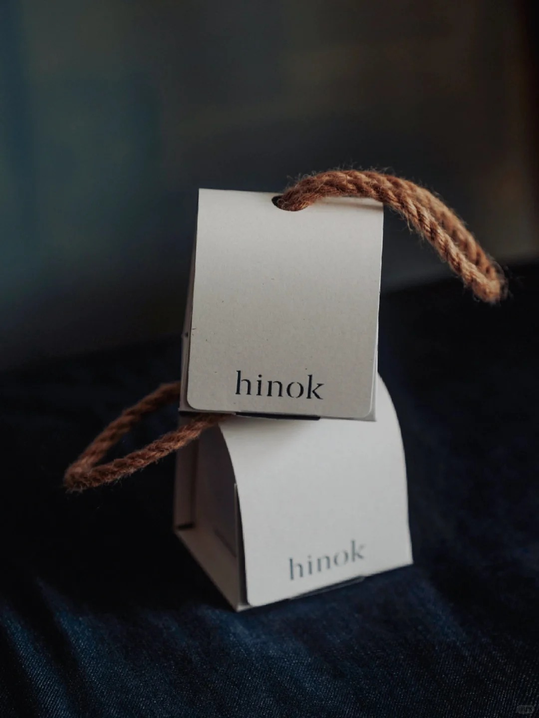 Eco-friendly flip-top paper box with natural rope handle for premium product packaging