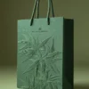 Embossed paper gift bag with rope handle for luxury brand packaging