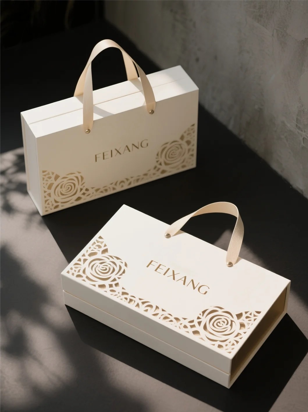 Luxury book style magnetic gift packaging box with handle and floral cutout design