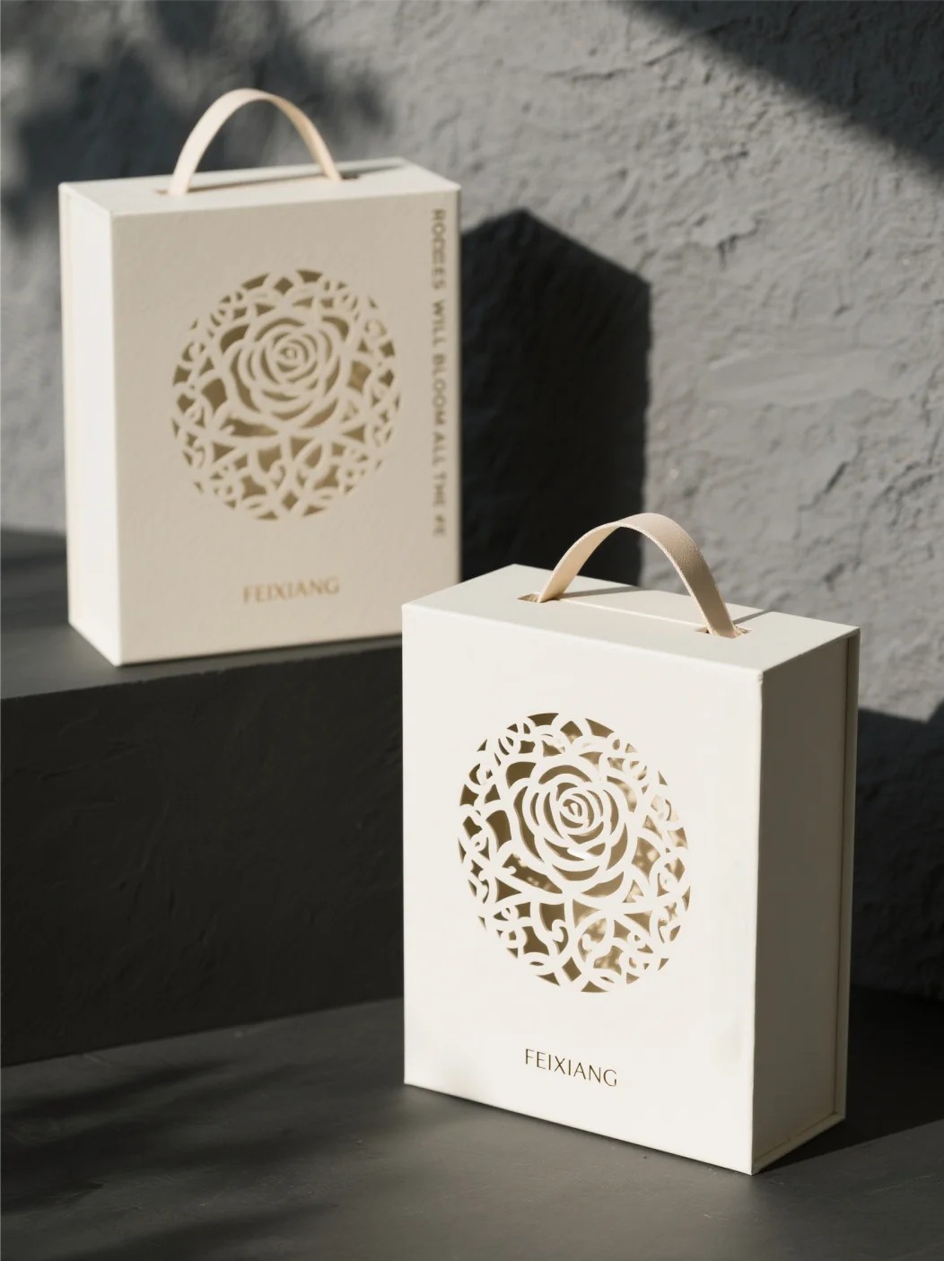 Luxury book style magnetic gift packaging box with handle and floral cutout design