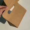 One-piece kraft paper folding gift box with integrated handle, eco-friendly packaging design