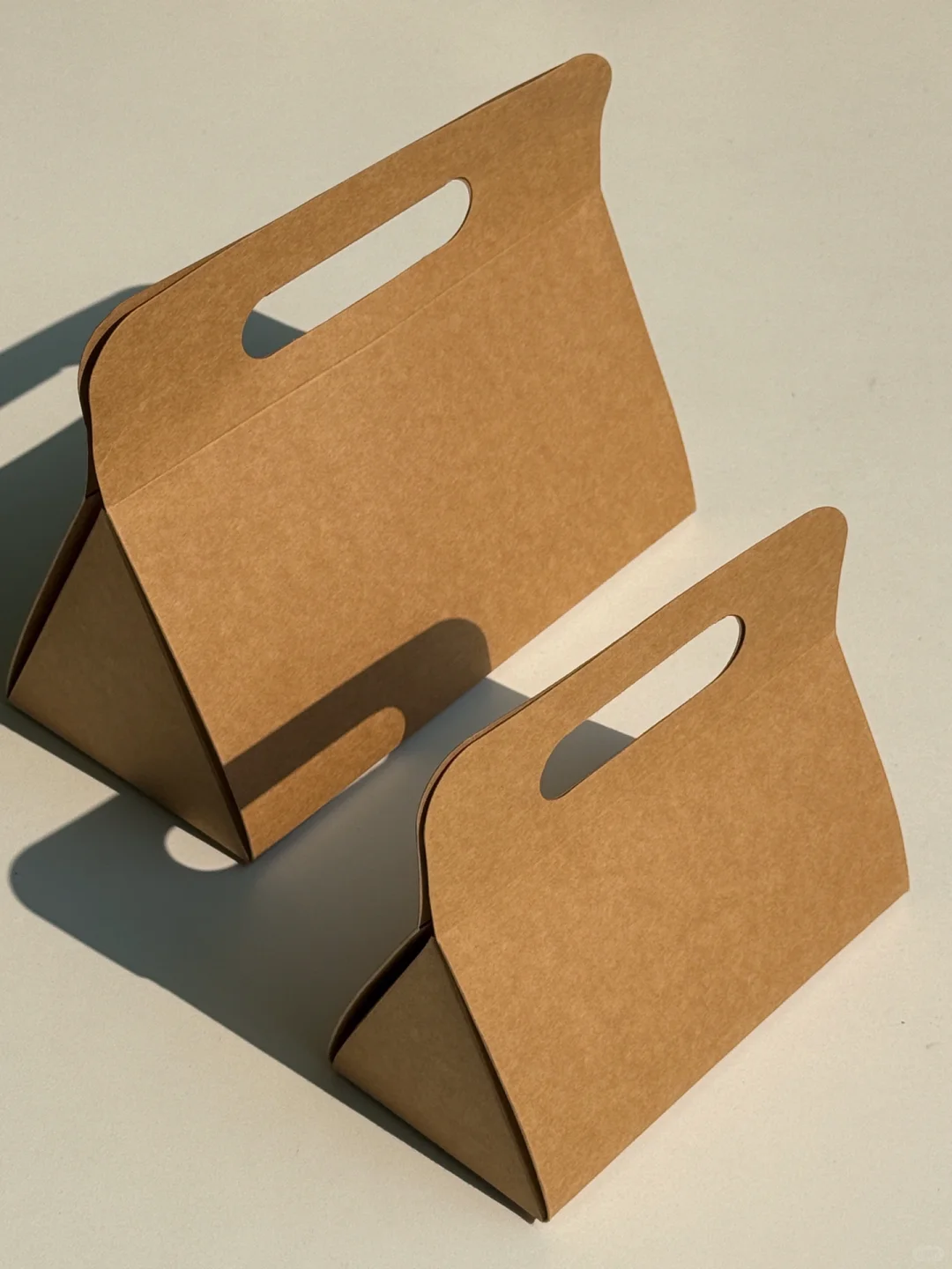 One-piece kraft paper folding gift box with integrated handle, eco-friendly packaging design
