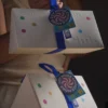 triangular magnetic flip top gift box with ribbon handle 2